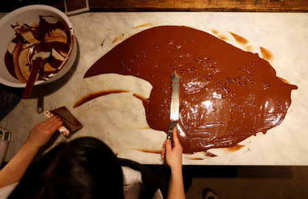 Chocolatier Louise Anderson prepares chocolate at Rabot 1745, in London, Britain December 1, 2017. REUTERS/Peter Nicholls