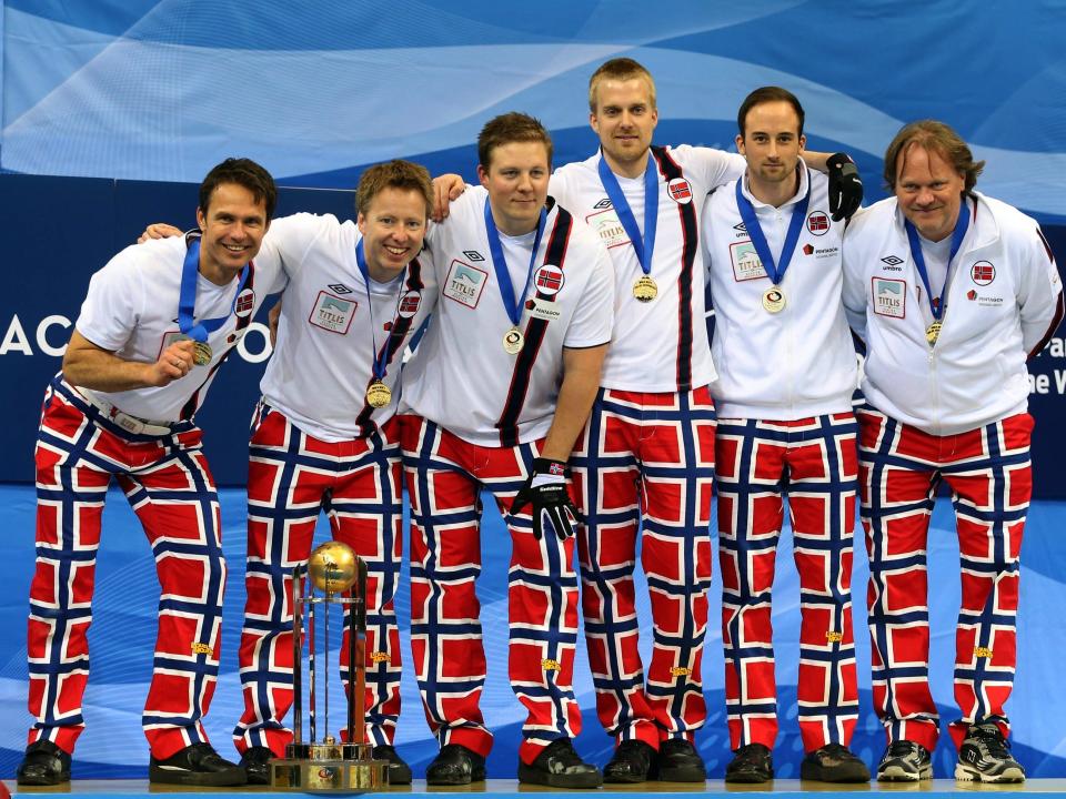 Norway's Olympic curling team in 2014 wearing red, print pants