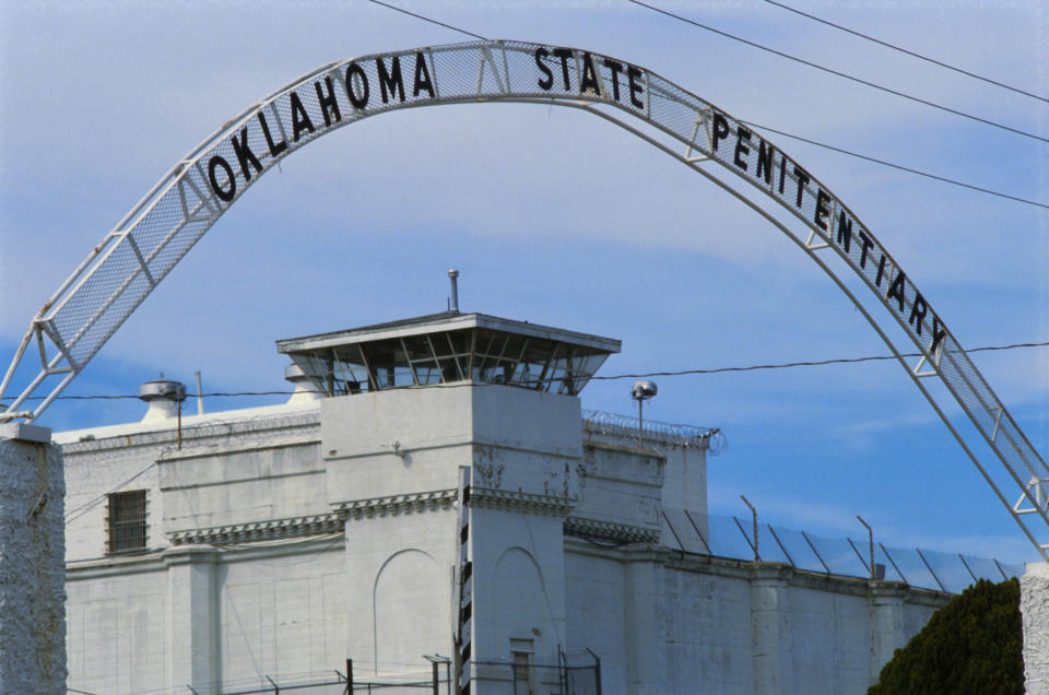 Entrance sign and guard tower at Oklahoma State Penitentiary.