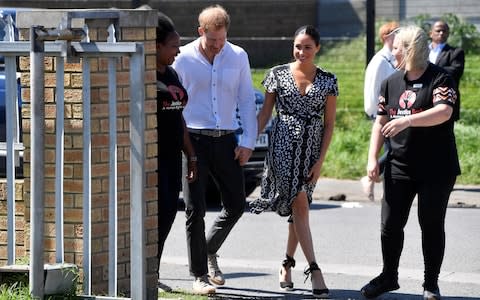 The Duke and Duchess of Sussex arrive at their first engagement - Credit: Reuters