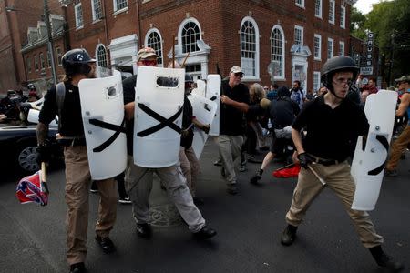 Members of white nationalists clash against a group of counter-protesters in Charlottesville, Virginia, U.S., August 12, 2017. REUTERS/Joshua Roberts/Files