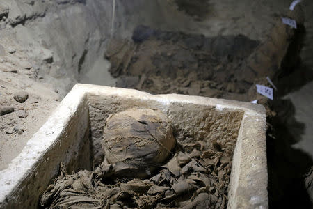 A mummy inside the newly discovered burial site in Minya, Egypt May 13, 2017. REUTERS/Mohamed Abd El Ghany