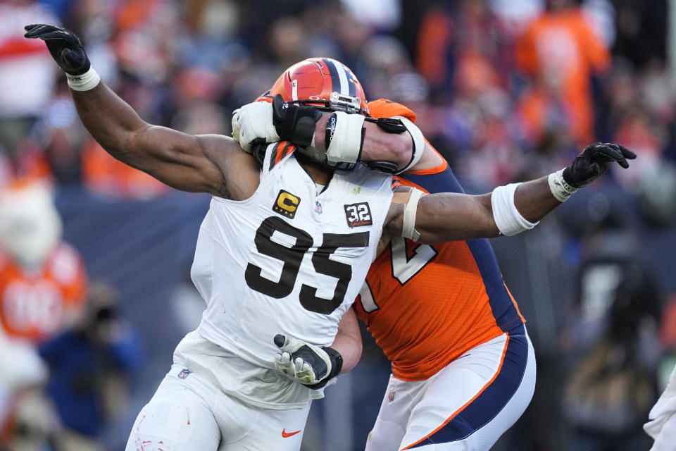 Cleveland Browns defensive end Myles Garrett (95) rushes the passer as Denver Broncos offensive tackle Garett Bolles (72) defends during the first half of an NFL football game on Sunday, Nov. 26, 2023, in Denver. (AP Photo/Jack Dempsey)