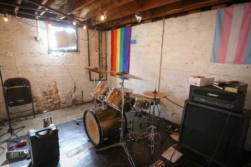A drum kit, amps and guitar pedals sit in the basement of Davey Grumbine's home on Wednesday, March 22, 2023. During the day, the basement functions as Grumbine's laundry room, but about once a month, Grumbine hosts concerts in the space.