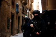 Armed police officers of the Malta Police Special Intervention Unit provide security as three men, accused of the assassination of anti-corruption journalist Daphne Caruana Galizia, arrive for their lawyers’ submissions for bail at the Courts of Justice in Valletta, Malta April 17, 2018. REUTERS/Darrin Zammit Lupi