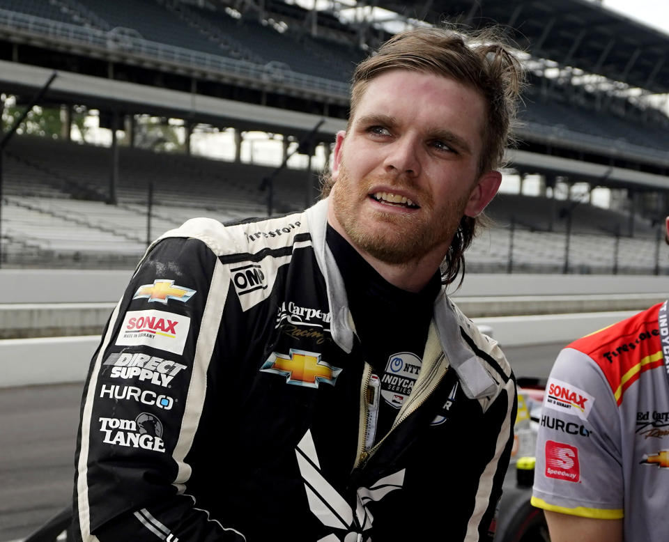 FILE - Conor Daly talks with his crew during practice for the Indianapolis 500 auto race at Indianapolis Motor Speedway, May 19, 2021, in Indianapolis. The IndyCar season begins Sunday, March 5, 2023, with the Grand Prix of St. Petersburg. (AP Photo/Darron Cummings, File)