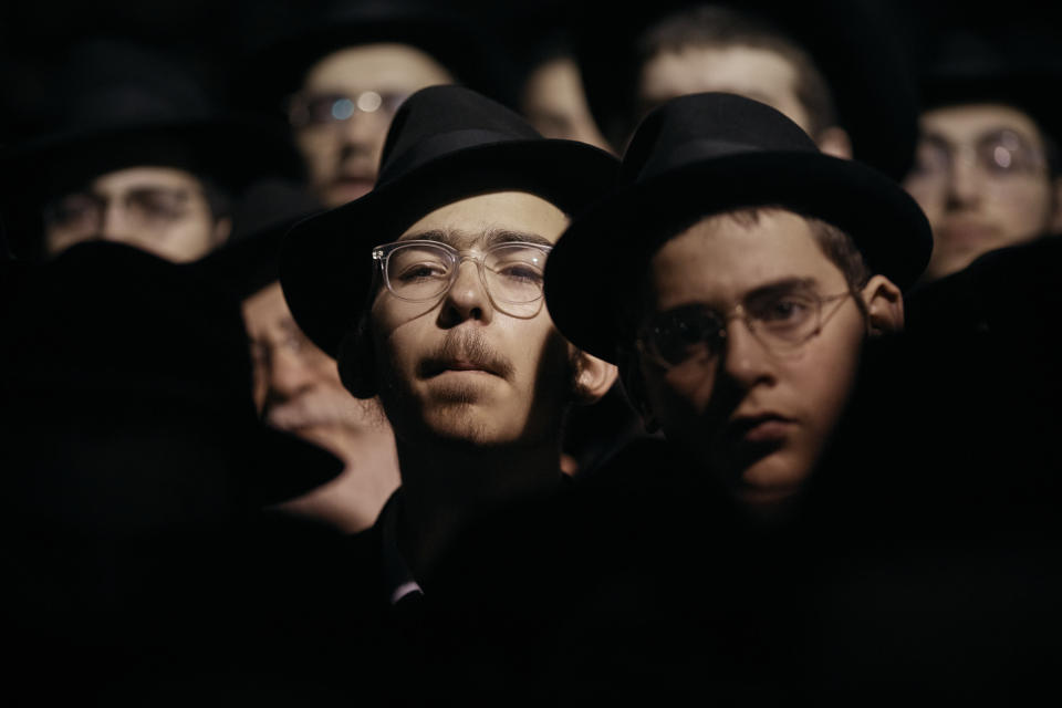 FILE - Chabad-Lubavitch Orthodox Jews listen during a prayer vigil held in solidarity with Israel on Monday, Oct. 9, 2023 in New York. (AP Photo/Andres Kudacki, File)