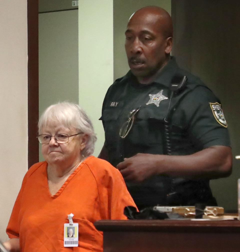 Ellen Gilland, accused of killing her terminally ill husband, is escorted to the defense table by a bailiff, Thursday, March 2, 2023, for a bond hearing before Judge Raul Zambrano at the S. James Foxman Justice Center in Daytona Beach.