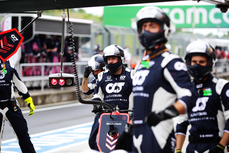 BUDAPEST, HUNGARY - JULY 19: Scuderia AlphaTauri team members prepare for a pitstop during the Formula One Grand Prix of Hungary at Hungaroring on July 19, 2020 in Budapest, Hungary. (Photo by Peter Fox/Getty Images)