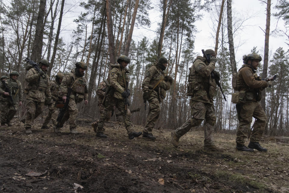 FILE - Ukrainian servicemen attend combat training in Kyiv region, Ukraine, Friday, March. 3, 2023. Europe’s biggest armed conflict since World War II is poised to enter a key new phase in the coming weeks. With no suggestion of a negotiated end to the 13 months of fighting between Russia and Ukraine, a counteroffensive by Kyiv’s troops is in the cards. (AP Photo/Efrem Lukatsky, File)