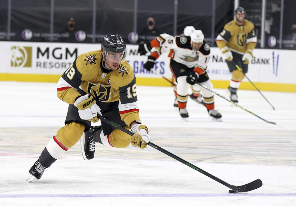Vegas Golden Knights right wing Reilly Smith (19) skates with the puck down the ice during the second period of the team's NHL hockey game against the Anaheim Ducks on Saturday, Jan. 16, 2021, in Las Vegas. (AP Photo/Isaac Brekken)