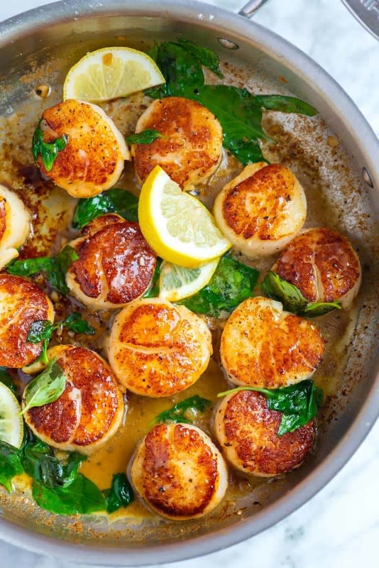 <p>Inspired Taste</p><p>These pan-seared scallops with garlic basil butter take less than 10 minutes and taste incredible!</p><p><strong>Get the recipe: <a href="https://www.inspiredtaste.net/37110/garlic-basil-seared-scallops/" rel="nofollow noopener" target="_blank" data-ylk="slk:Garlic Basil Seared Scallops;elm:context_link;itc:0;sec:content-canvas" class="link rapid-noclick-resp">Garlic Basil Seared Scallops</a></strong></p>