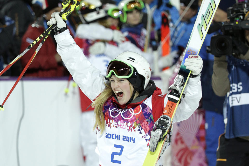 Canada's Justine Dufour-Lapointe celebrates after winning the gold medal final in the women's moguls at the 2014 Winter Olympics, Saturday, Feb. 8, 2014, in Krasnaya Polyana, Russia. (AP Photo/Jae C. Hong)