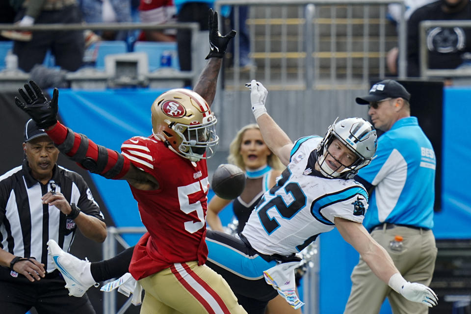 San Francisco 49ers linebacker Dre Greenlaw breaks up a pass intended for Carolina Panthers running back Christian McCaffrey during the first half an NFL football game on Sunday, Oct. 9, 2022, in Charlotte, N.C. (AP Photo/Rusty Jones)
