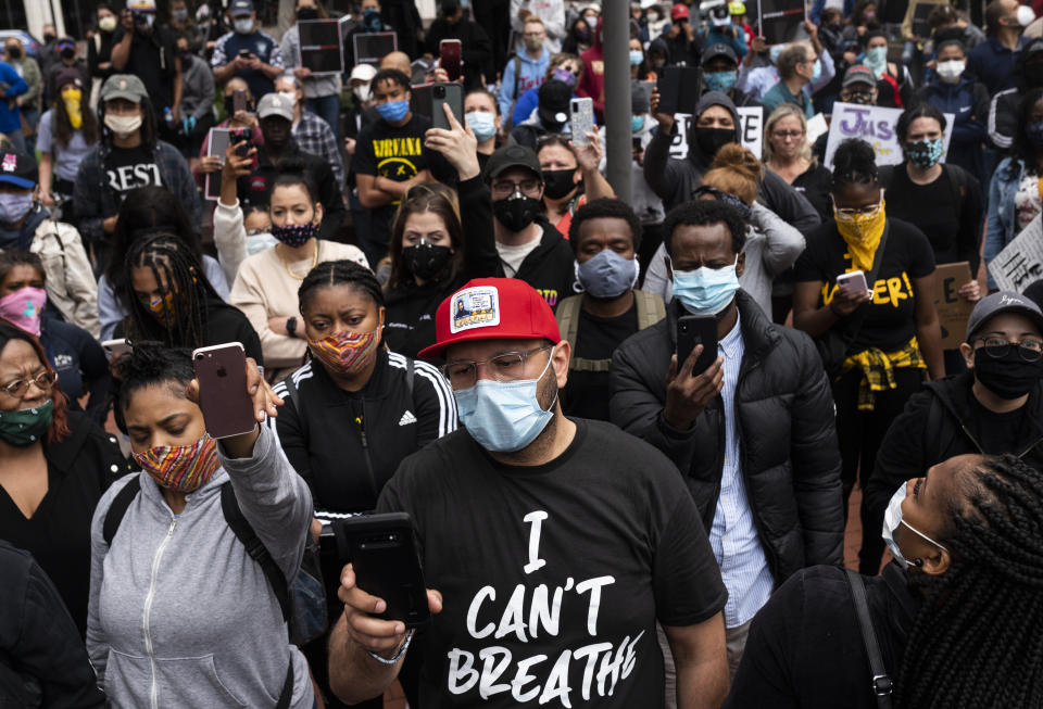 A crowd listens as Valerie Castile, mother of Philando Castile, speaks during a protest with Former NBA player Stephen Jackson in response to the police killing of George Floyd.