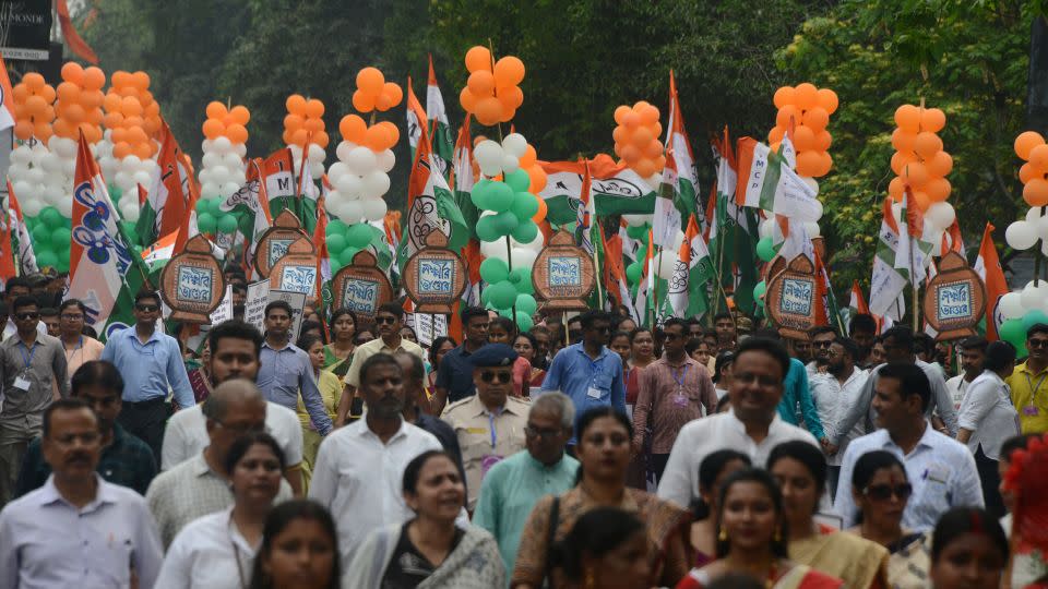 Supporters of the All India Trinamool Congress (AITC) participate in an election campaign rally on Hill Cart Road in Siliguri, India, on April 16, 2024. - Diptendu Dutta/NurPhoto/Getty Images