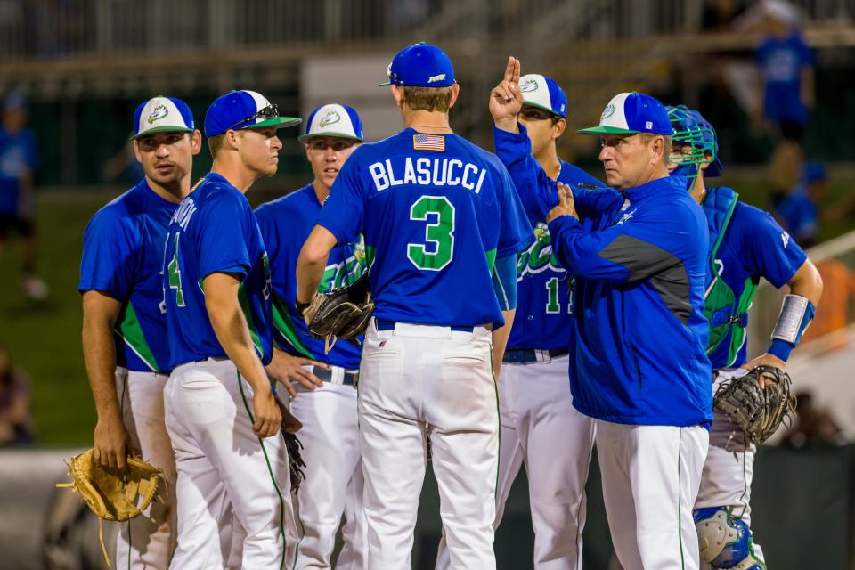 FGCU coach Dave Tollett makes a pitching change during a game against the University of Miami in 2016.