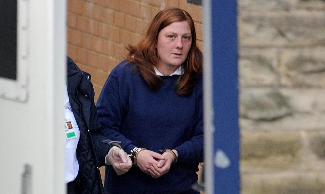 ALTERNATE CROP. Karen Matthews, mother of Shannon Matthews, is led from Dewsbury police station, before her court appearance in connection with the alleged abduction of her daughter.   (Photo by Anna Gowthorpe - PA Images/PA Images via Getty Images)