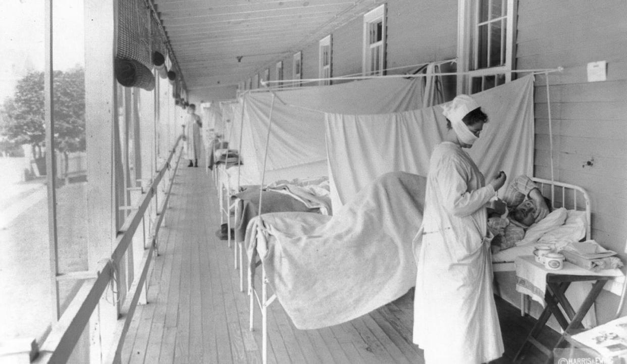 In this November 1918 photo, a nurse tends to a patient in the influenza ward of the Walter Reed hospital in Bethesda, Md. <a href="https://newsroom.ap.org/detail/VirusOutbreak1918InfluenzaCOVID19/97d84472fcad44449444ae3b7cc5f539/photo?Query=1918%20flu&mediaType=photo&sortBy=&dateRange=Anytime&totalCount=91&currentItemNo=29" rel="nofollow noopener" target="_blank" data-ylk="slk:AP Photo/Harris & Ewing via Library of Congress;elm:context_link;itc:0;sec:content-canvas" class="link ">AP Photo/Harris & Ewing via Library of Congress</a>