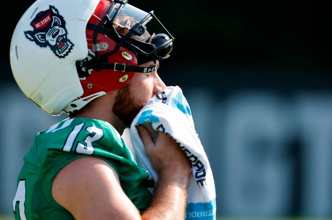 N.C. State quarterback Devin Leary (13) cools down during the Wolfpack’s first practice of fall camp in Raleigh, N.C., Wednesday, August 3, 2022.