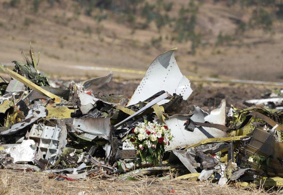 A bouquet of flowers beside debris at the scene of the Ethiopian Airlines Flight 302 in 2019 (Getty Images)