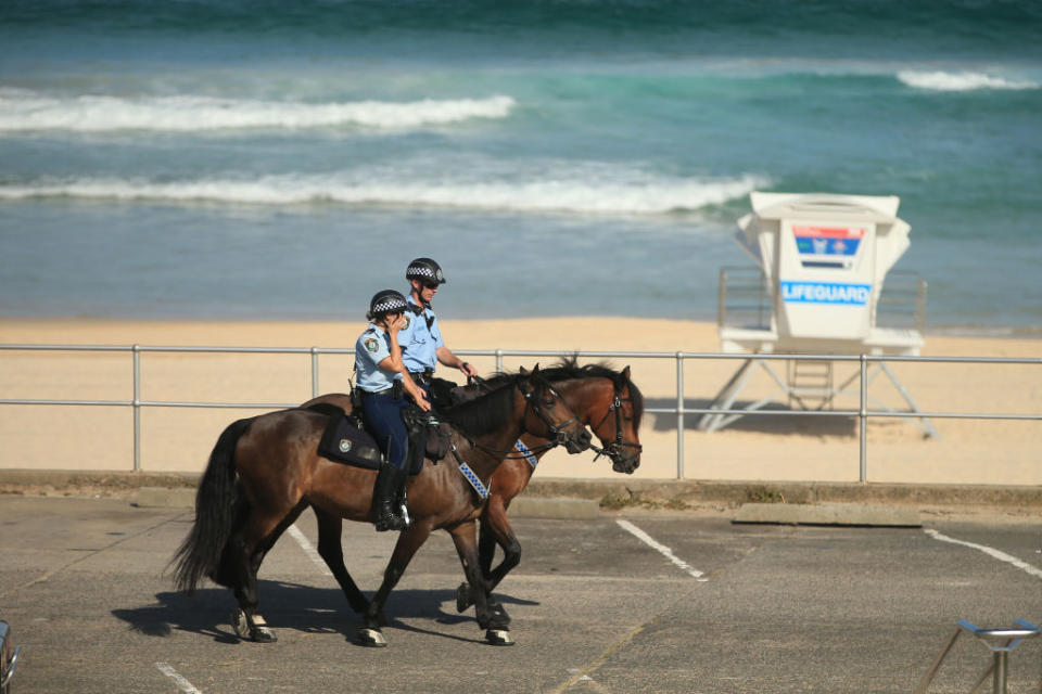 Mounted Police patrol Bondi Beach as all eastern suburbs beaches are closed.