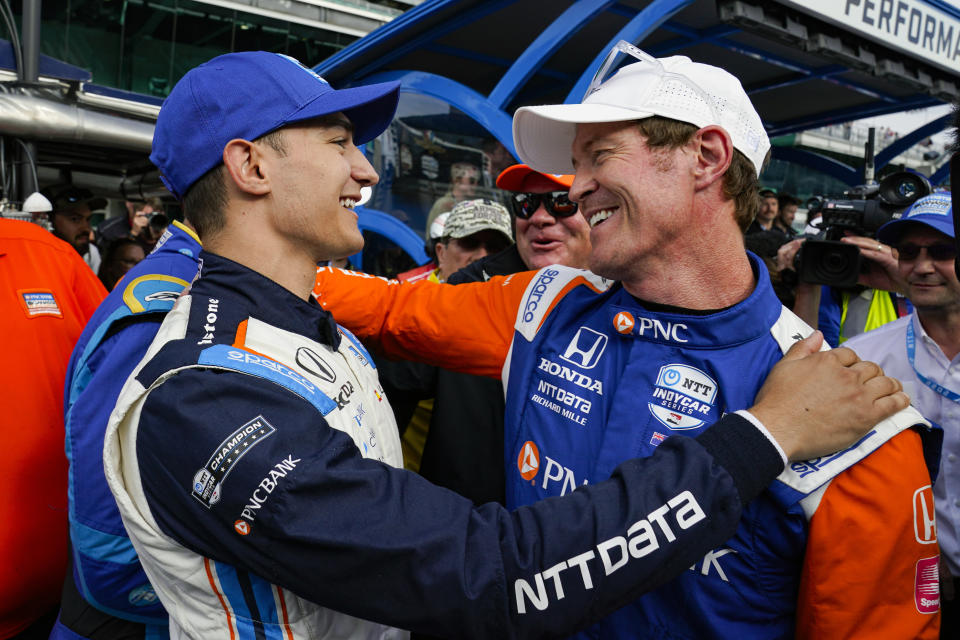 Scott Dixon, of New Zealand, right, celebrates winning the pole with second place finisher Alex Palou, of Spain, during qualifications for the Indianapolis 500 auto race at Indianapolis Motor Speedway in Indianapolis, Sunday, May 22, 2022. (AP Photo/Michael Conroy)