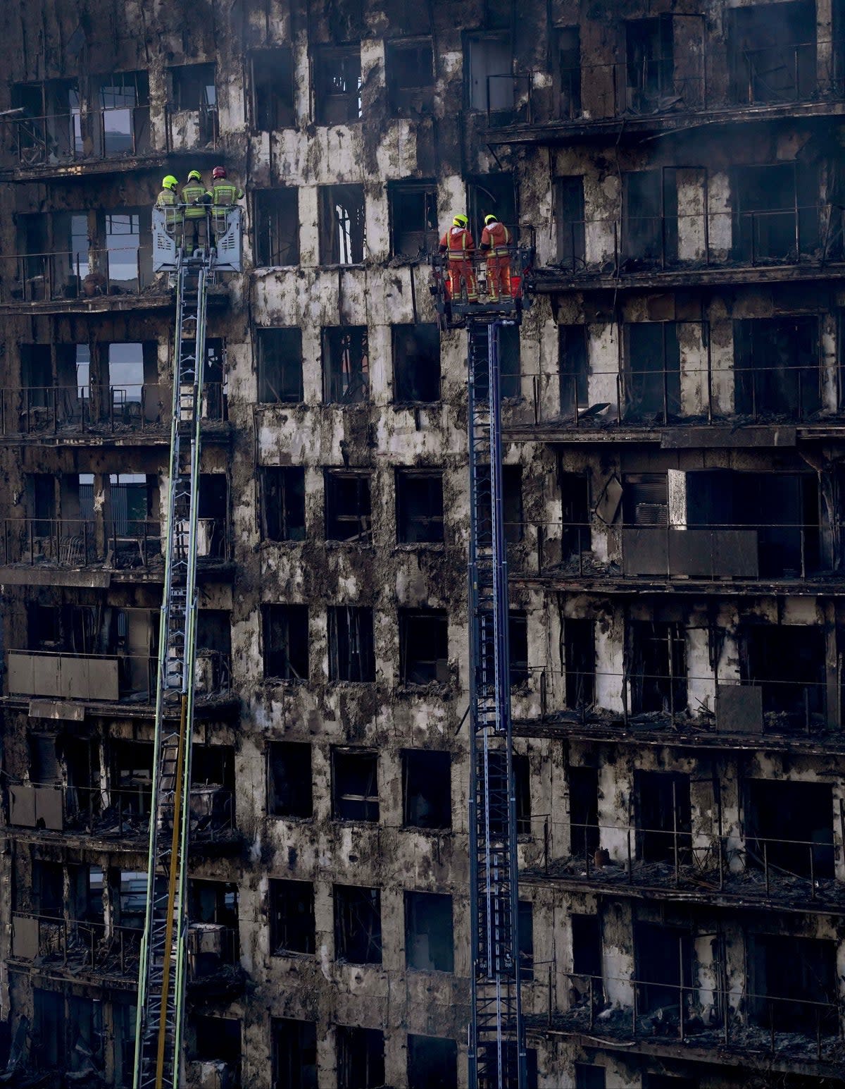 Firefighters work at the burned block building in Valencia after the blaze (AP Photo/Alberto Saiz) (AP)