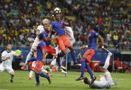 Colombia's Yerry Mina, top, heads the ball during a Copa America Group B soccer match at the Arena Fonte Nova in Salvador, Brazil, Saturday, June 15, 2019. (AP Photo/Natacha Pisarenko)