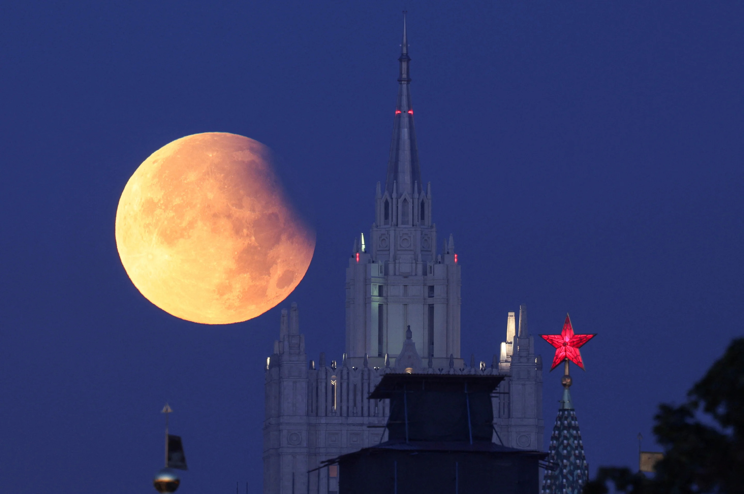 Partial lunar eclipse is seen near the Kremlin and Russia's Foreign Ministry headquarters in Moscow on Wednesday.