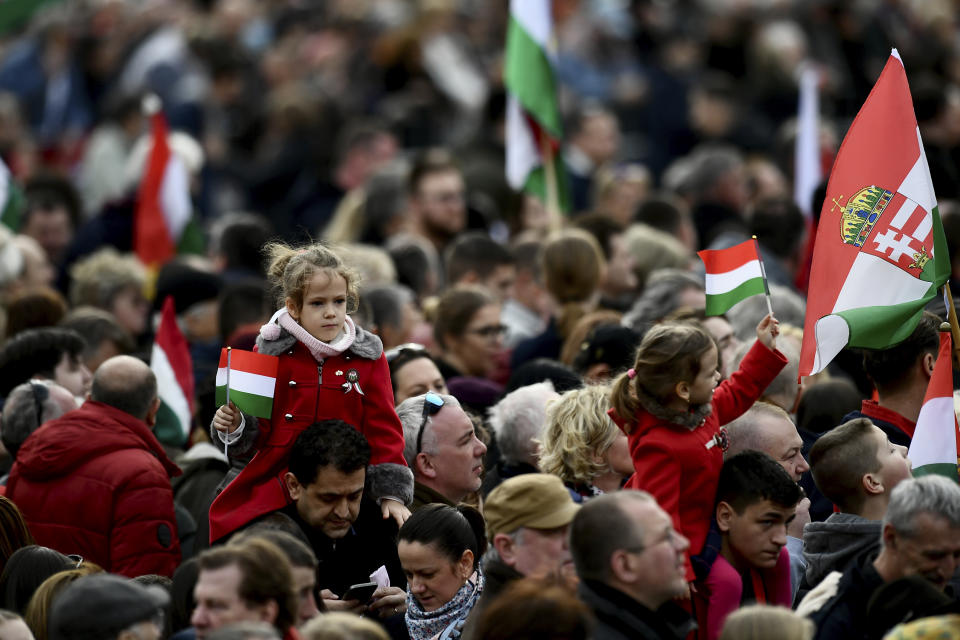 Thousands of supporters of Hungary's right-wing populist prime minister, Viktor Orban, gather in Budapest, Hungary, Tuesday, March 15, 2022. The so-called "peace march" was a show of strength by Orban's supporters ahead of national elections scheduled for April 3, while a coalition of six opposition parties also held a rally in the capital. (AP Photo/Anna Szilagyi)