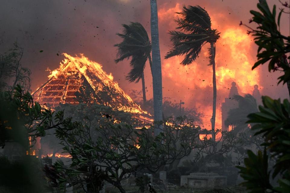 The hall of historic Waiola Church and nearby Lahaina Hongwanji Mission in Lahaina, Maui, ablaze on Tuesday (AP)