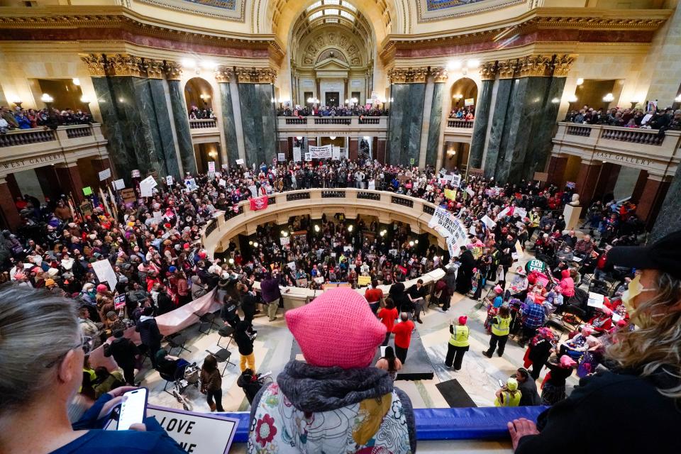 Protesters are seen in the Wisconsin Capitol Rotunda during a march supporting overturning Wisconsin's near total ban on abortion Sunday, Jan. 22, 2023, in Madison, Wis.