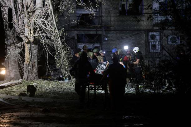 Rescuers carry a wounded person from a damaged residential building following Russian missiles strikes in Pokrovsk, Donetsk region, amid Russian invasion of Ukraine (AFP via Getty Images)
