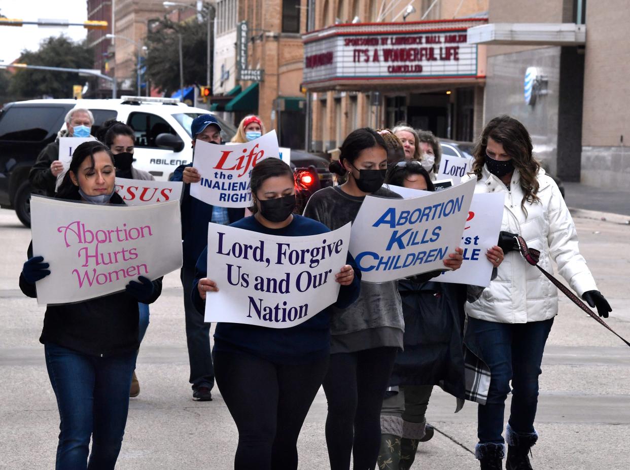 Demonstrators walk on Cypress Street during the March for Life on Jan. 23 2021. West Texas for Life organized the annual procession.
