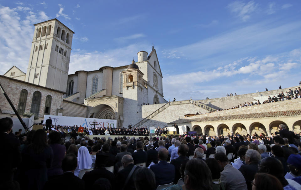 FILE - In this Tuesday, Sept. 20, 2016 file photo, a moment of the closing event of an inter-religious prayer gathering, in front of the Basilica of St. Francis, Assisi, Italy. The Franciscan friars in Assisi say Pope Francis will journey there next month to sign a new encyclical, expected to stress the value of brotherly relations during and after the pandemic, in what could be his first visit outside of the Rome area since Italy went into lockdown. (AP Photo/Alessandra Tarantino, File)