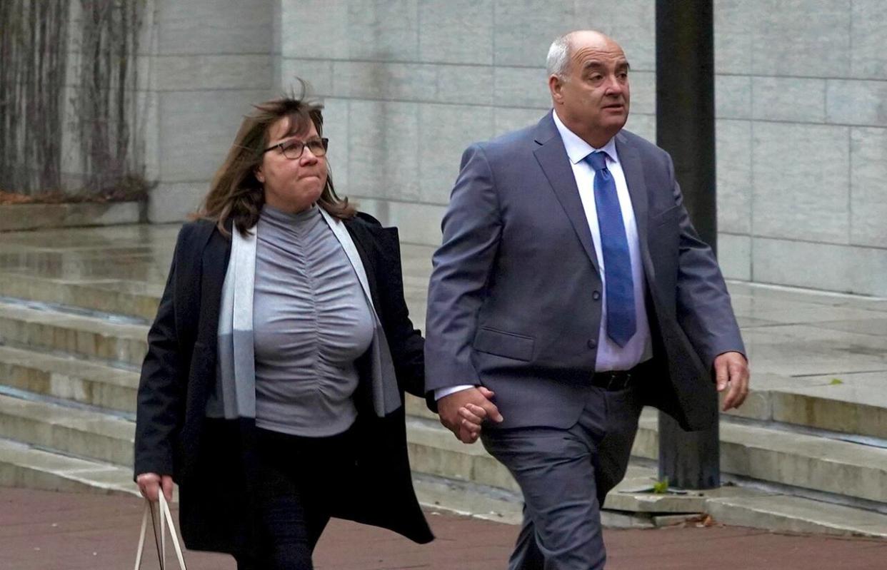 Ottawa Fire Services Capt. Greg Wright, right, approaches the Ottawa Courthouse on May 8, 2024. (Patrick Louiseize/CBC - image credit)