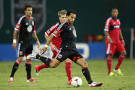 WASHINGTON, DC - AUGUST 4: Dwayne De Rosario #7 of D.C. United passes the ball despite the attention of Chris Rolfe #18 of the Chicago Fire at RFK Stadium on August 22, 2012 in Washington, DC.(Photo by Ned Dishman/Getty Images)