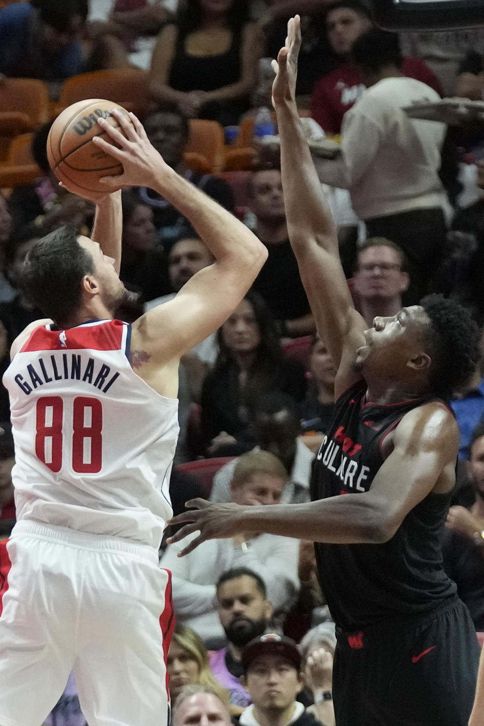 Washington Wizards forward Danilo Gallinari (88) takes a shot against Miami Heat center Thomas Bryant during the first half of an NBA basketball game, Friday, Nov. 3, 2023, in Miami. (AP Photo/Wilfredo Lee)