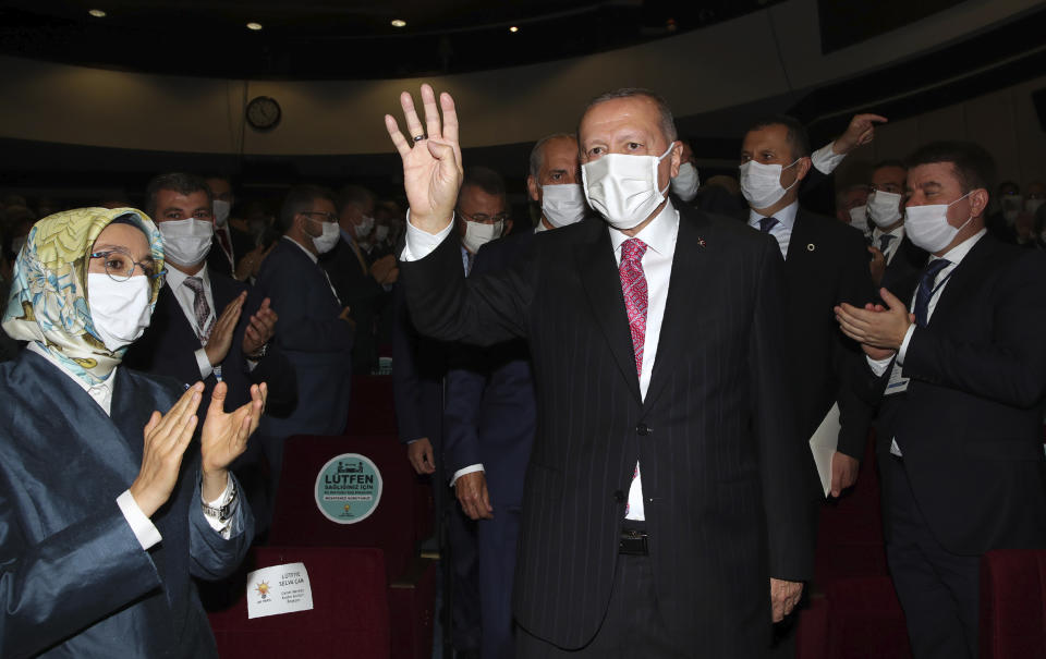 Turkey's President Recep Tayyip Erdogan arrives to address his party members, in Ankara, Turkey, Thursday, Aug. 13, 2020. Greece’s prime minister has warmly thanked France for its decision to boost its military presence in the eastern Mediterranean, where Greek and Turkish warships are closely shadowing each other over a Turkish energy exploration bid in waters Athens claims as its own. (Turkish Presidency via AP, Pool)