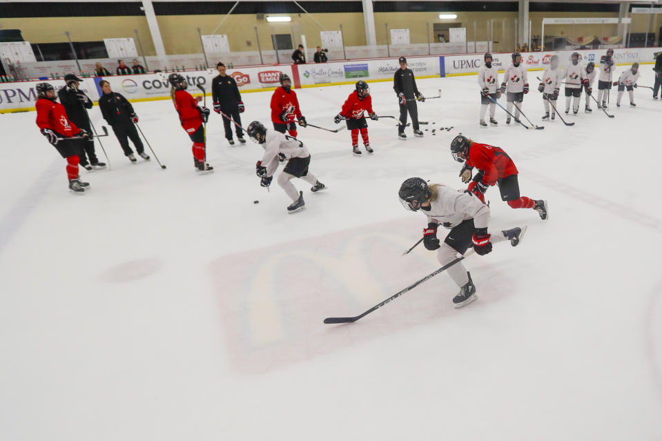 In this photo taken Monday, Nov. 4, 2019, members of the Canada Women's National hockey team drill during their practice in Cranberry Township, Butler County, Pa. Many of the top women’s hockey players on the planet say they’re resolute in their decision to not play professionally in North America until a new league that provides better pay and better benefits materializes. (AP Photo/Keith Srakocic)