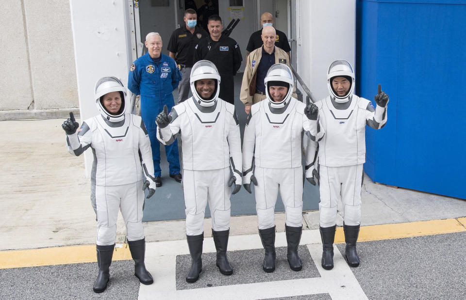 Left to right: NASA astronauts Shannon Walker, Victor Glover, Mike Hopkins and Japan's Soichi Noguchi arrive at Kennedy Space Station to prepare for launch aboard a SpaceX Crew Dragon to the International Space Station.  / Credit: NASA/Joel Kowsky