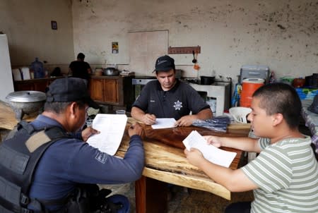Vigilantes are seen at the command headquarters in the municipality of Coahuayana