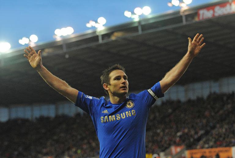 Chelsea's English midfielder Frank Lampard celebrates after scoring at the Britannia Stadium in Stoke-on-Trent, central England on January 12, 2013