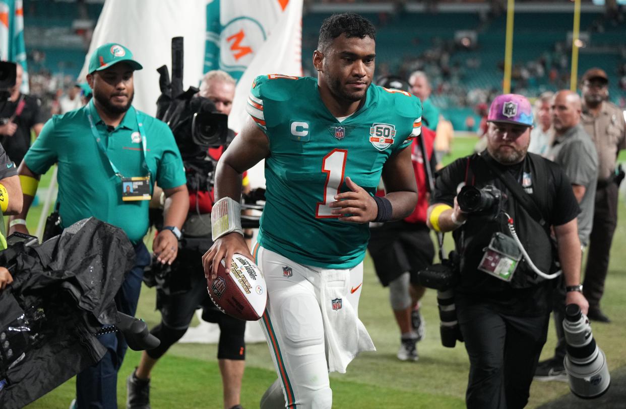 Miami Dolphins quarterback Tua Tagovailoa (1) runs off the field after defeating the Pittsburgh Steelers 16-10 at Hard Rock Stadium in Miami Gardens on Oct. 23.