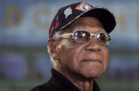 FILE - Negro leagues great Buck O'Neil listens to remarks during a news conference for the former Kansas City Monarch at the Negro Leagues Baseball Museum in Kansas City, Mo., on Feb. 27, 2006. O’Neil, a champion of Black ballplayers during a monumental, eight-decade career on and off the field, has joined Gil Hodges, Minnie Minoso and three others in being elected to the baseball Hall of Fame, on Sunday, Dec. 5, 2021. (AP Photo/Chris Cummins, File)