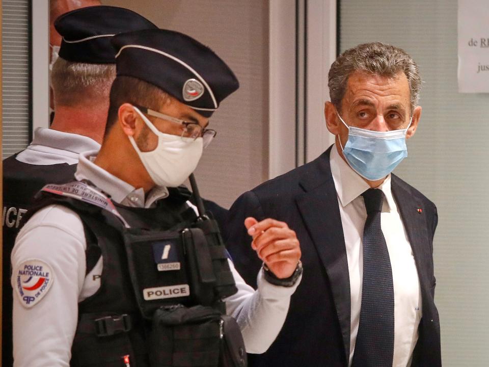 Former French President Nicolas Sarkozy leaves court after the opening of his trial for corruption and influence pedalling on 23 November, 2020 in Paris, France (Getty Images)