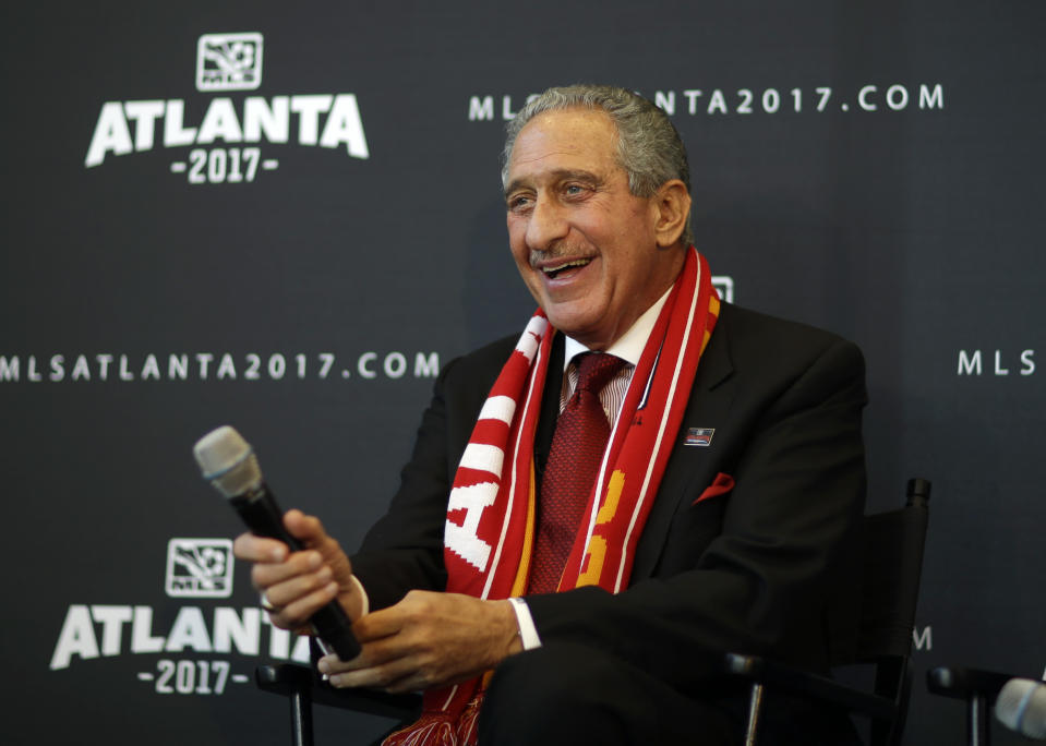 Atlanta Falcons owner Arthur Blank smiles during a news conference announcing the city is getting a Major League Soccer expansion team on Wednesday, April 16, 2014, in Atlanta. MLS announced its newest franchise, unveiling a the team for Atlanta that will begin play in 2017 at the city's new retractable roof stadium. (AP Photo/David Goldman)