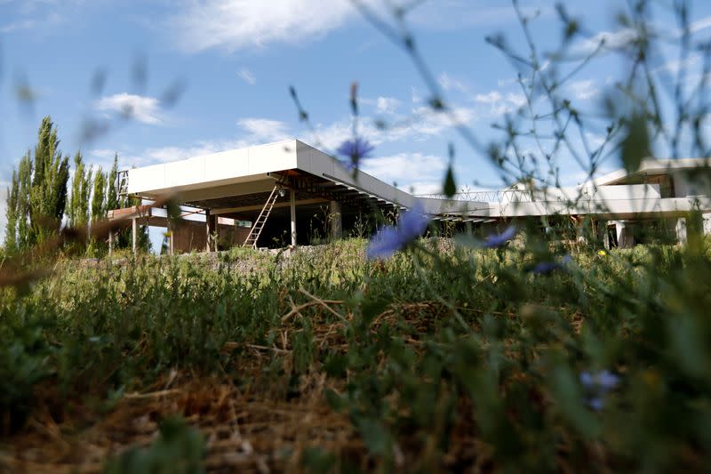 An unfinished hotel is seen on the outskirts of Neuquen