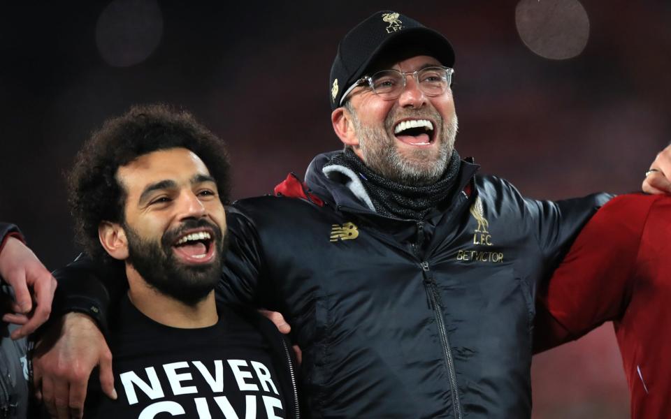 Mohamed Salah and Jurgen Klopp celebrate after beating Barcelona in the Champions League in 2019 - PA